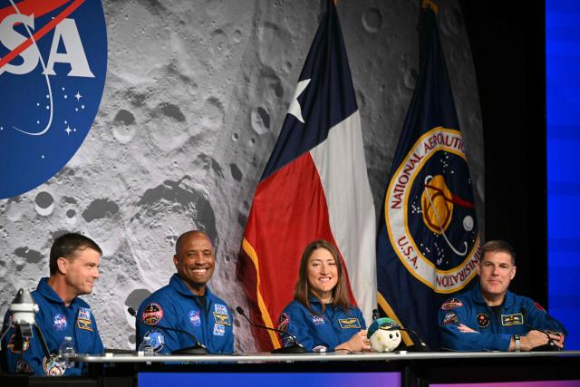 (L-R) NASA's Artemis II mission astronauts, commander Reid Wiseman, Victor Glover, Christina Koch and Canadian Space Agency's Jeremy Hansen attend a press conference at Johnson Space Center in Houston, Texas, on April 16, 2026. The astronauts did the first slingshot around the Moon in more than 50 years and traveled deeper into space than any humans before, culminating in a smooth splashdown on April 10 off the coast of California. (Photo by RONALDO SCHEMIDT / AFP)