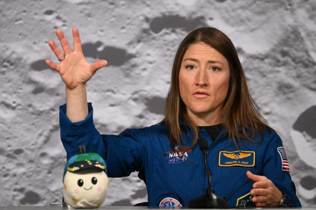NASA's Artemis II mission astronaut Christina Koch speaks during a press conference at Johnson Space Center in Houston, Texas, on April 16, 2026. The four astronauts of Artemis II mission did the first slingshot around the Moon in more than 50 years and traveled deeper into space than any humans before, culminating in a smooth splashdown on April 10 off the coast of California. (Photo by RONALDO SCHEMIDT / AFP)