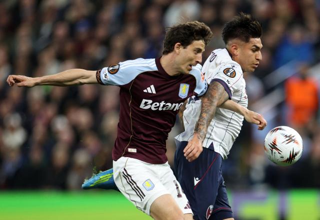 Aston Villa's Spanish defender #14 Pau Torres (L) vies with Bologna's Argentine striker #09 Santiago Castro during the UEFA Europa League, quarter final second-leg football match between Aston Villa and Bologna at Villa Park in Birmingham, central England on April 16, 2026. (Photo by Darren Staples / AFP)
