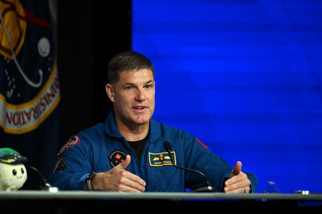 NASA's Artemis II mission astronaut Canadian Space Agency's Jeremy Hansen speaks during a press conference at Johnson Space Center in Houston, Texas, on April 16, 2026. The four astronauts of Artemis II mission did the first slingshot around the Moon in more than 50 years and traveled deeper into space than any humans before, culminating in a smooth splashdown on April 10 off the coast of California. (Photo by RONALDO SCHEMIDT / AFP)