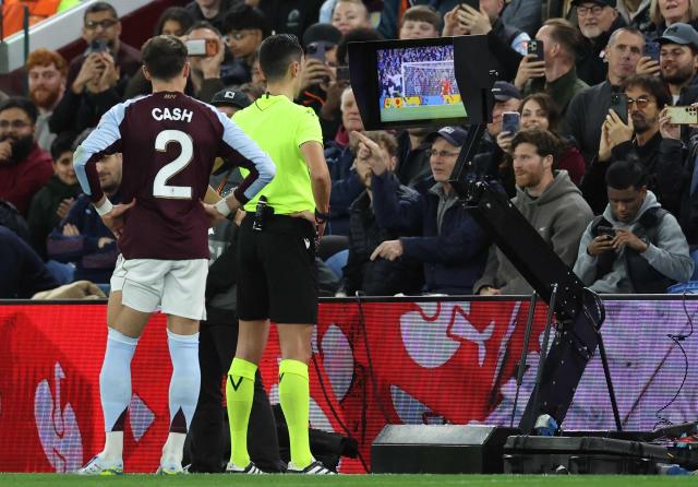 Spanish refereeJosé María Sánchez Martínez watches a replay on a screen during a VAR Review, before awarding a penlaty to Villa for a handball by Bologna's Czech defender #41 Martin Vitik, during the UEFA Europa League, quarter final second-leg football match between Aston Villa and Bologna at Villa Park in Birmingham, central England on April 16, 2026. (Photo by Darren Staples / AFP)