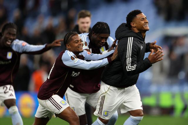 Aston Villa's English striker #11 Ollie Watkins (R) and Aston Villa's Jamaican midfielder #31 Leon Bailey (C) celebrate with teammates after the UEFA Europa League, quarter final second-leg football match between Aston Villa and Bologna at Villa Park in Birmingham, central England on April 16, 2026. Villa won the match 4-0. (Photo by Darren Staples / AFP)