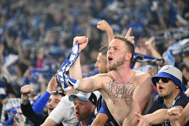 Strasbourg's supporters celebrate their team's victory in the stands at the end of the UEFA Europa Conference League quarter-final second leg football match between RC Strasbourg Alsace and Mainz 05 at the Stade de La Meinau in Strasbourg, eastern France, on April 16, 2026. (Photo by SEBASTIEN BOZON / AFP)