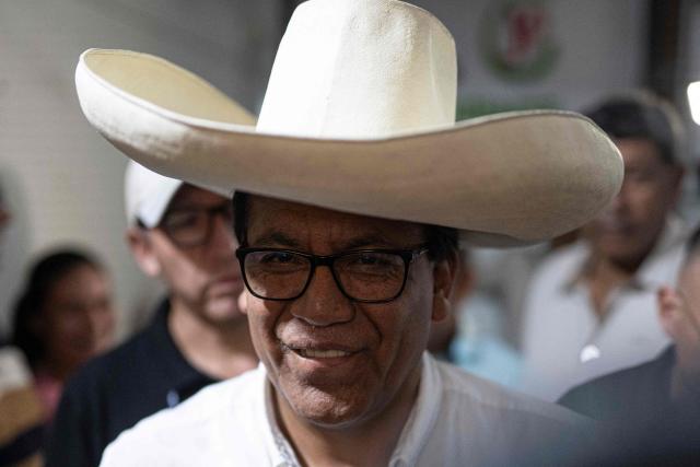 Peru's presidential candidate for the Juntos por el Peru party, Roberto Sanchez, looks on a press conference at his campaign office in Lima on April 16, 2026. On April 16, Peru's right-wing presidential hopeful Rafael Lopez Aliaga offered a $5,800 reward to any election official who produced proof of his claim that the April 12 election was fraudulent. (Photo by Ernesto BENAVIDES / AFP)