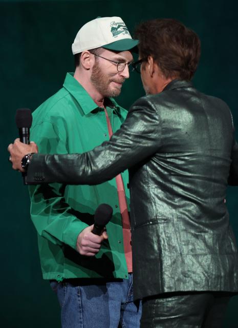US actor Chris Evans (L) and US actor Robert Downey Jr. (R) promote "Avengers: Doomsday" during the Walt Disney Studios presentation at CinemaCon at The Colosseum at Caesars Palace on April 16, 2026 in Las Vegas, Nevada. (Photo by VALERIE MACON / AFP)