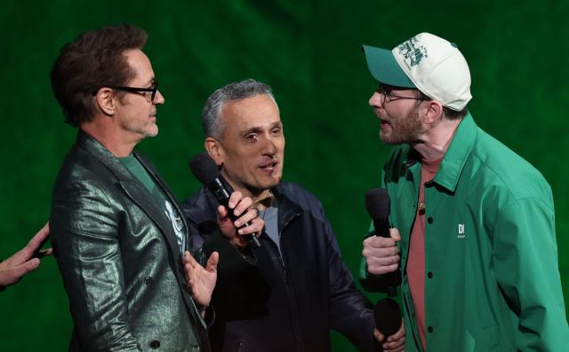 US actor Chris Evans (R), US actor Robert Downey Jr. (R) and US filmmaker Joe Russo (C) promote "Avengers: Doomsday" during the Walt Disney Studios presentation at CinemaCon at The Colosseum at Caesars Palace on April 16, 2026 in Las Vegas, Nevada. (Photo by VALERIE MACON / AFP)