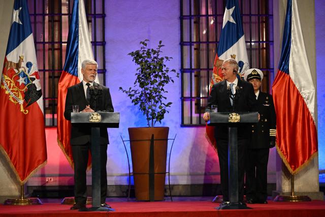 Czech President Petr Pavel (L) speaks next to Chile's President Jose Antonio Kast during a joint press conference at La Moneda Presidential Palace in Santiago on April 16, 2026. (Photo by RODRIGO ARANGUA / AFP)