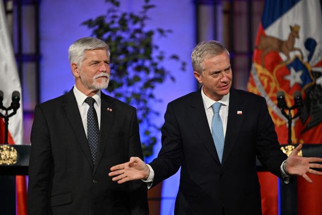 Chile's President Jose Antonio Kast (R) gestures next to Czech President Petr Pavel during a joint press conference at La Moneda Presidential Palace in Santiago on April 16, 2026. (Photo by RODRIGO ARANGUA / AFP)