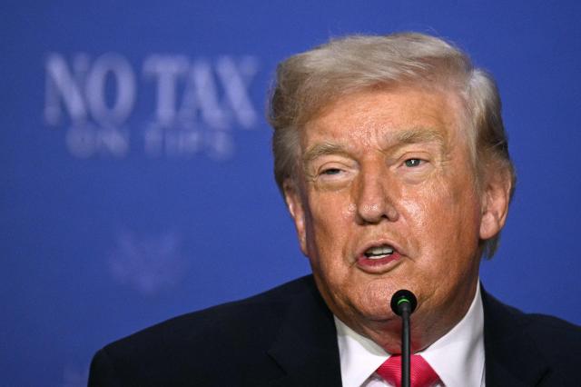 US President Donald Trump speaks during a roundtable discussion on his "no tax on tips" policy at the AC Hotel Las Vegas Symphony Park in Las Vegas, Nevada, on April 16, 2026. (Photo by Jim WATSON / AFP)