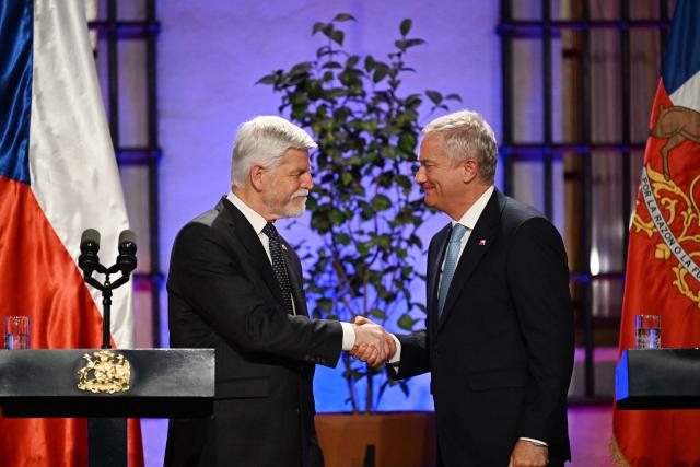 Chile's President Jose Antonio Kast (R) shakes hands with Czech President Petr Pavel during a joint press conference at La Moneda Presidential Palace in Santiago on April 16, 2026. (Photo by RODRIGO ARANGUA / AFP)