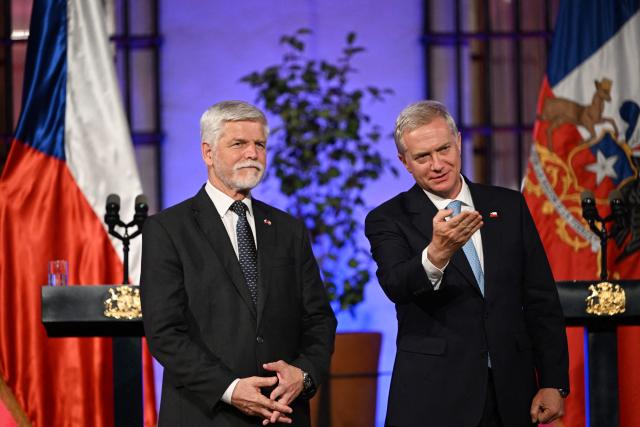 Chile's President Jose Antonio Kast (R) gestures next to Czech President Petr Pavel during a joint press conference at La Moneda Presidential Palace in Santiago on April 16, 2026. (Photo by RODRIGO ARANGUA / AFP)