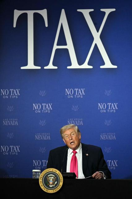 US President Donald Trump speaks during a roundtable discussion on his "no tax on tips" policy at the AC Hotel Las Vegas Symphony Park in Las Vegas, Nevada, on April 16, 2026. (Photo by Jim WATSON / AFP)