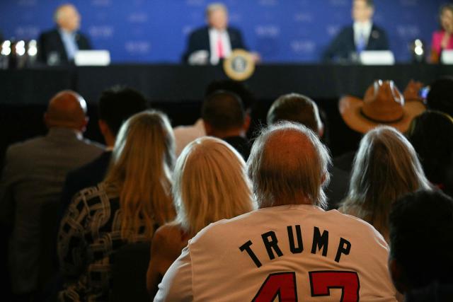 A member of the audience wears a Trump jersey during a roundtable discussion on the US president's "no tax on tips" policy at the AC Hotel Las Vegas Symphony Park in Las Vegas, Nevada, on April 16, 2026. (Photo by Jim WATSON / AFP)