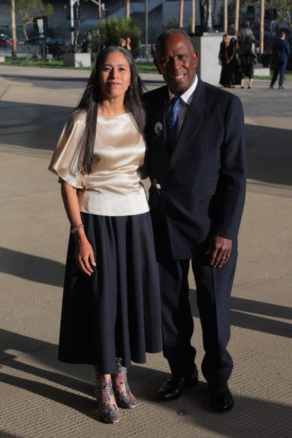 US visual artist Charles Gaines (R) and Roxana Landaverde attend the Los Angeles County Museum of Art's (LACMA) opening gala for the David Geffen Galleries at LACMA in Los Angeles, on April 16, 2026. (Photo by Etienne LAURENT / AFP)
