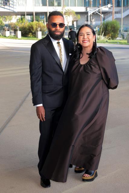 Bahamian artist Tavares Strachan (L) and guest attend the Los Angeles County Museum of Art's (LACMA) opening gala for the David Geffen Galleries at LACMA in Los Angeles, on April 16, 2026. (Photo by Etienne LAURENT / AFP)