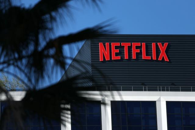 (FILES) The Netflix logo is pictured at the company’s Hollywood studio offices at Sunset Bronson Studios in Los Angeles, California on December 5, 2025. Netflix shares plummeted more than nine percent on April 16, 2026 as the TV streaming titan's quarterly earnings failed to impress investors and co-founder Reed Hastings announced he is leaving. (Photo by Patrick T. Fallon / AFP)