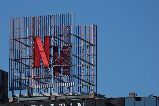 (FILES) This aerial picture taken on December 5, 2025, shows the Netflix logo across from Hollywood studio offices in Los Angeles, California. Netflix shares plummeted more than nine percent on April 16, 2026 as the TV streaming titan's quarterly earnings failed to impress investors and co-founder Reed Hastings announced he is leaving. (Photo by Patrick T. Fallon / AFP)