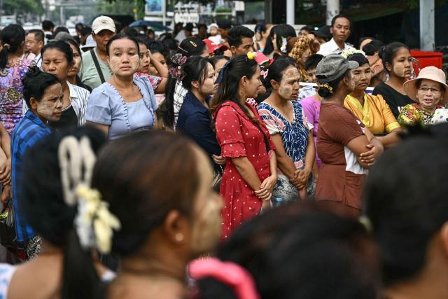 Relatives wait for the release of prisoners from Insein prison to mark the Myanmar New Year in Yangon on April 17, 2026. (Photo by Sai Aung MAIN / AFP)