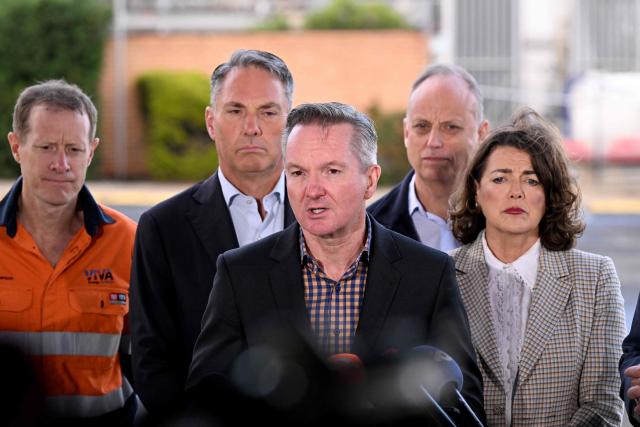 Minister for Climate Change and Energy Chris Bowen (C) speaks at a press conference during a visit to the Geelong Oil Refinery in Geelong on April 17, 2026. The visit comes a day after a fire ripped through the oil refinery but Australia's deputy Prime Minister Richard Marles said it would have a minimal impact on fuel supply. (Photo by William WEST / AFP)