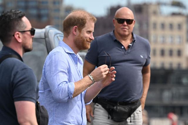 Britain’s Prince Harry, Duke of Sussex, arrives to meet members of the public beneath the steps of Australia’s iconic Sydney Opera House on April 17, 2026. (Photo by Saeed KHAN / AFP)