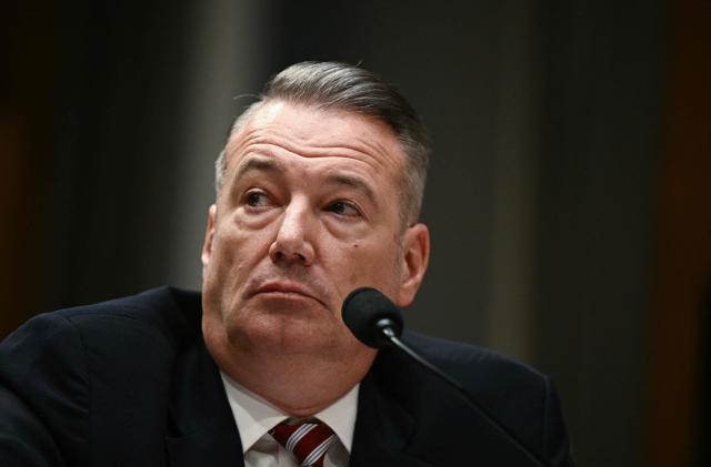 (FILES) Acting Director of US Immigration and Customs Enforcement (ICE) Todd Lyons testifies during the Senate Homeland Security and Governmental Affairs Committee in an oversight hearing amid scrutiny over immigration enforcement and recent developments in Minnesota at the Dirksen Senate Office Building in Washington, DC on February 12, 2026. Lyons, will leave his post at the agency charged with enforcing US President Donald Trump's anti-immigrant crackdown in May, the Homeland Security Secretary announced Thursday. (Photo by Brendan SMIALOWSKI / AFP)