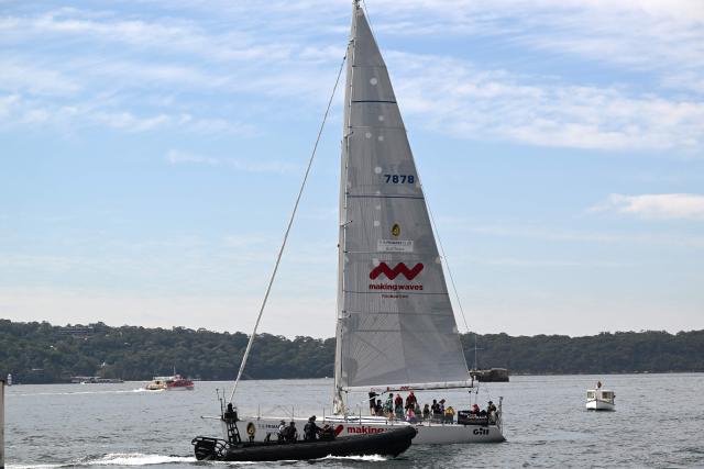 Britain's Prince Harry, Duke of Sussex, and his wife Meghan, the Duchess of Sussex, take part in a sailing event with members of Invictus Australia in Sydney Harbour on April 17, 2026. (Photo by Saeed KHAN / AFP)