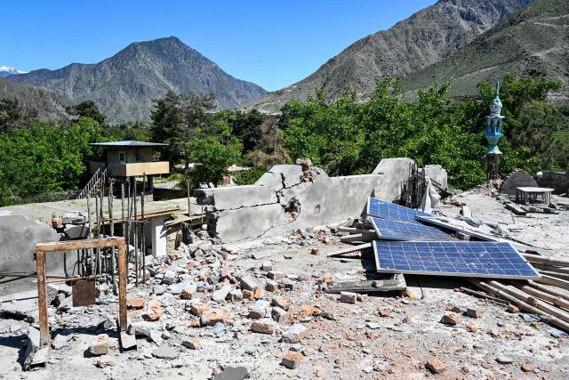 This photograph taken on April 13, 2026 shows the damaged rooftop of a mosque after it was struck by a Pakistani mortar shell during clashes between Taliban security personnel and Pakistani forces near the Durand Line in the Barikot village of Naray district, Kunar province. There are no children in the Afghan border village of Barikot, where the school has been smashed by shells and the playground sits deserted after weeks of war with Pakistan. More than 94,000 Afghans have been displaced by the war, OCHA figures show, more than a quarter of them in Kunar province. (Photo by Wakil KOHSAR / AFP)