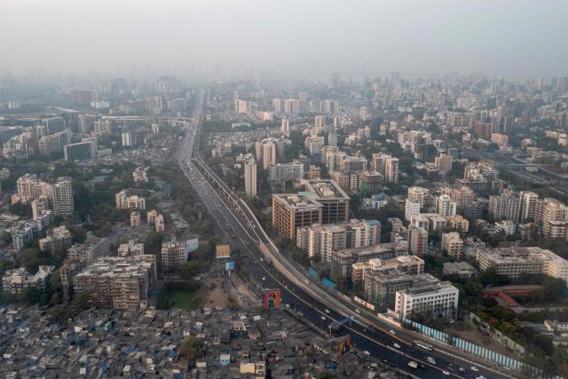 This aerial picture shows the city's skyline in Mumbai on April 17, 2026. (Photo by Punit PARANJPE / AFP)