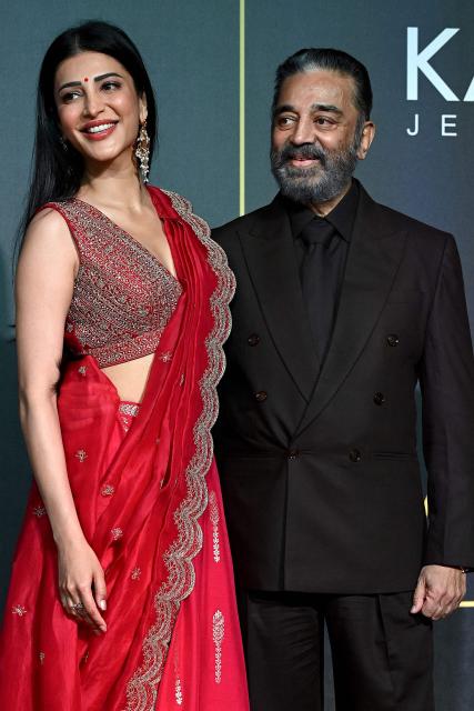 Indian actress Shruti Haasan with her father, actor and politician Kamal Haasan attend the Indian National Cine Academy Awards in Mumbai on April 16, 2026. (Photo by SUJIT JAISWAL / AFP)