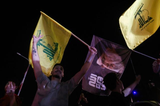 Hezbollah supporters celebrate a ceasefire with Israel in Sidon early on April 17, 2026. A 10-day ceasefire deal struck between Lebanon and Israel took effect on April 17, sending displaced residents streaming south towards their homes, even as the Lebanese army warned of "a number of violations" in the area. (Photo by MAHMOUD ZAYYAT / AFP)