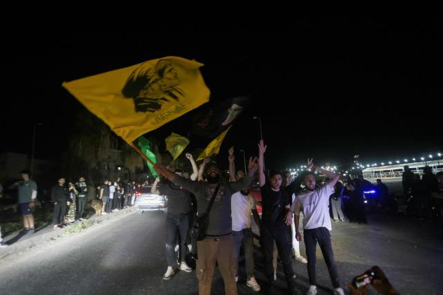 Hezbollah supporters celebrate a ceasefire with Israel in Sidon early on April 17, 2026. A 10-day ceasefire deal struck between Lebanon and Israel took effect on April 17, sending displaced residents streaming south towards their homes, even as the Lebanese army warned of "a number of violations" in the area. (Photo by MAHMOUD ZAYYAT / AFP)