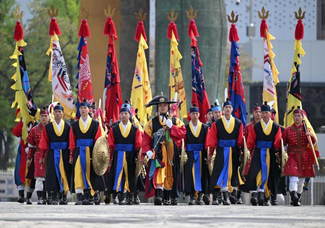 South Korean traditional honour guards perform during a public event to show their acrobatic performance at the War Memorial of Korea in Seoul on April 17, 2026. (Photo by Jung Yeon-je / AFP)