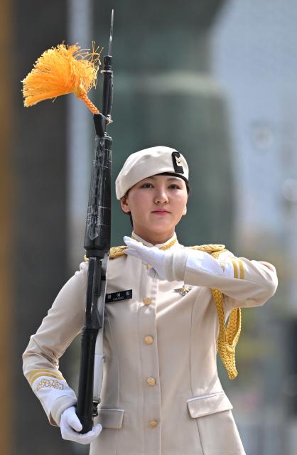 A South Korean military honour guard performs during a public event to show their acrobatic performance at the War Memorial of Korea in Seoul on April 17, 2026. (Photo by Jung Yeon-je / AFP)