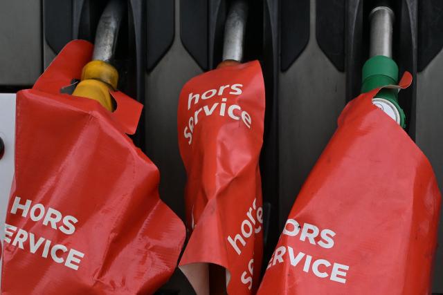 Out of service fuel pumps are pictured at a gas station blocked by Argedis employees to demand fuel assistance in Saint-Aubin-de-Terregatte, western France on April 17, 2026. The CGT union at Argedis, a TotalEnergies subsidiary that operates around 200 service stations, notably on motorways, has called on employees to strike on April 17, 2026 to demand financial assistance with fuel costs, amid soaring prices, the union said on April 16. (Photo by Damien MEYER / AFP)