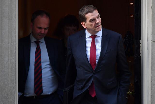 (FILES) Number 10 Chief of Staff Gavin Barwell (L) and Oliver "Olly" Robbins, the Prime Minister Theresa May's Europe Adviser, leave from 10 Downing Street in London on March 14, 2019, ahead of a further Brexit vote. A top UK foreign ministry official will step down, local media reported late on April 16, 2026, as the government faces fresh pressure over its past appointment of an associate of Jeffrey Epstein as US ambassador. The UK Foreign Office's Permanent Under-Secretary Olly Robbins will leave his role after losing the confidence of Prime Minister Keir Starmer, media including the Press Association (PA) news agency and BBC reported. (Photo by Ben STANSALL / AFP)