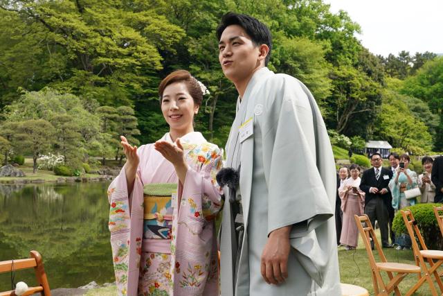 Japanese Olympic figure skating pairs champions Riku Miura (L) and Ryuichi Kihara (R) attend the spring garden party hosted by Japan's Emperor Naruhito and Empress Masako at the Akasaka Palace's imperial garden in Tokyo on April 17, 2026. (Photo by Kazuhiro NOGI / POOL / AFP)