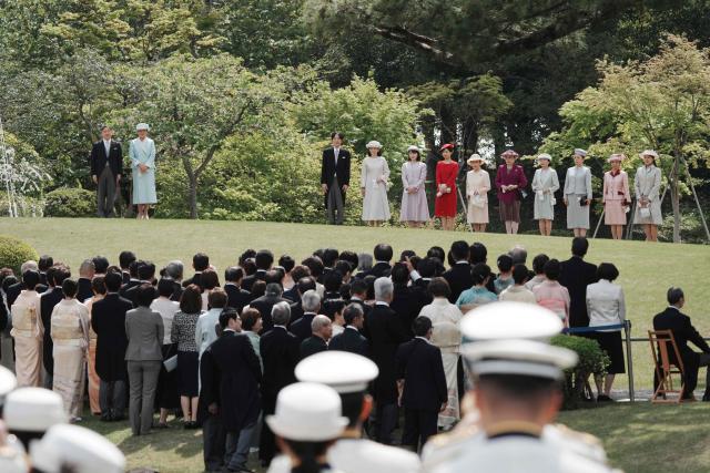 Japan's Emperor Naruhito (L) and Empress Masako (2nd L), along with members of the royal family, attend the spring garden party at the Akasaka Palace's imperial garden in Tokyo on April 17, 2026. (Photo by Kazuhiro NOGI / POOL / AFP)