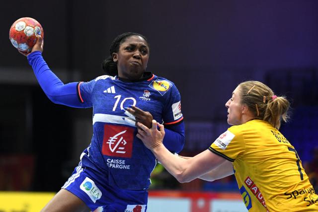 (FILES) France’s center back #10 Grace Zaadi Deuna shoots the ball during the European Women's EHF EURO 2024 Handball Championship Group I main round match between Sweden and France in Debrecen, Hungary, on December 8, 2024. (Photo by FERENC ISZA / AFP)