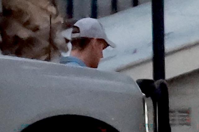 Australian SAS soldier Ben Roberts-Smith (C) is escorted from the Silverwater Correctional Complex after being released on bail in Sydney on April 17, 2026. An Australian court granted bail on April 17 to former soldier Ben Roberts-Smith, charged with murdering unarmed prisoners captured in Afghanistan following a sweeping war crimes probe. (Photo by DAVID GRAY / AFP)