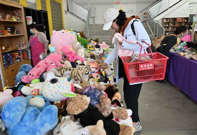 People visit a second-hand market in Beijing on April 17, 2026. (Photo by ADEK BERRY / AFP)