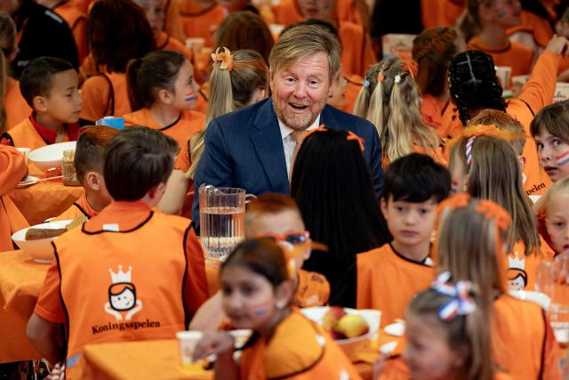 King Willem-Alexander speaks with children as he attends the national opening of the King's Games in Zeewolde on April 17, 2026. The King visited public primary school Panta Rhei and ICB Kaleidoscoop, where he attended various sports and games activities after the King's Breakfast. (Photo by Ramon van Flymen / ANP / AFP) / Netherlands OUT