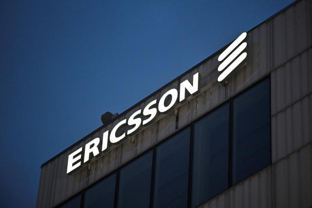 (FILES) The logo of Swedish multinational networking and telecommunications company Ericsson is pictured at the company's headquarters in Stockholm, Sweden, after the company published fourth quarter results on January 23, 2024. Swedish telecoms equipment maker Ericsson posted on April 17, 2026 a nearly 80 percent plunge in net profit as sales fell while the company faced rising costs and negative currency effects. The company reported net profit of 900 million kronor (USD 98 million) for the first quarter, down 79 percent from the period a year earlier, as revenues slid 10 percent to 49.3 billion kronor. The decline was especially pronounced in the Americas due to softening demand and uncertainty over customs duties, and was not offset by growth in other regions, Ericsson noted. (Photo by Henrik MONTGOMERY / TT News Agency / AFP) / Sweden OUT
