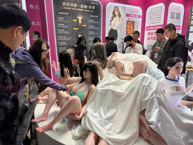 EDITORS NOTE: Graphic content / People visit the Shanghai International Adult Products Industry Exhibition (API Expo 2026) on April 17, 2026. (Photo by CN-STR / AFP) / China OUT