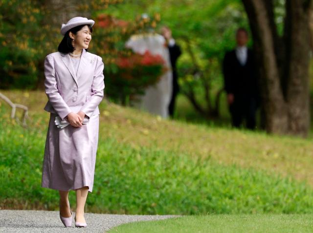 Japan's Princess Aiko, daughter of Emperor Naruhito and Empress Masako, attends the spring imperial garden party at the Akasaka Palace's imperial garden in Tokyo on April 17, 2026. (Photo by Franck ROBICHON / POOL / AFP)