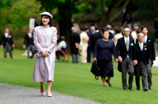 Japan's Princess Aiko, daughter of Emperor Naruhito and Empress Masako, attends the spring imperial garden party at the Akasaka Palace's imperial garden in Tokyo on April 17, 2026. (Photo by Franck ROBICHON / POOL / AFP)