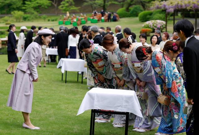 Japan's Princess Aiko, daughter of Emperor Naruhito and Empress Masako, greets Japanese medallists of the Milan Cortina Winter Olympics during the spring imperial garden party at the Akasaka Palace's imperial garden in Tokyo on April 17, 2026. (Photo by Franck ROBICHON / POOL / AFP)