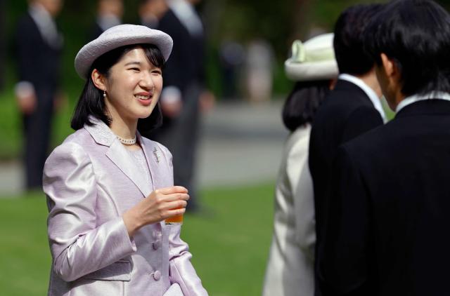 Japan's Princess Aiko, daughter of Emperor Naruhito and Empress Masako, speaks with Japanese medallists of the Milan Cortina Winter Olympics during the spring imperial garden party at the Akasaka Palace's imperial garden in Tokyo on April 17, 2026. (Photo by Franck ROBICHON / POOL / AFP)