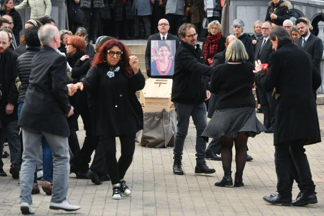 (FILES) Relatives dance near the coffin during the funeral ceremony of French teacher Agnes Lassalle at the Sainte-Eugenie church in Biarritz, southwestern France, on March 3, 2023. The trial of the pupil accused of the murder of Agnes Lassalle, a teacher stabbed to death in 2023 in Saint-Jean-de-Luz will begin behind closed doors on April 21, 2026 at the Juvenile Criminal Court of the Pyrénées-Atlantiques. (Photo by GAIZKA IROZ / AFP)