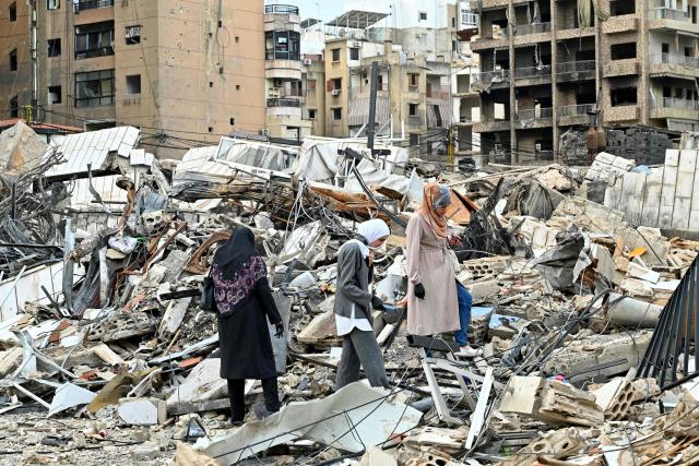Lebanese women check destruction as they return to their neighbourhood in Beirut's southern suburbs after a 10-day ceasefire with Israel came into effect on April 17, 2026. A 10-day ceasefire deal struck between Lebanon and Israel took effect on April 17, sending displaced residents streaming south towards their homes, even as the Lebanese army warned of "a number of violations" in the area. (Photo by FADEL itani / AFP)