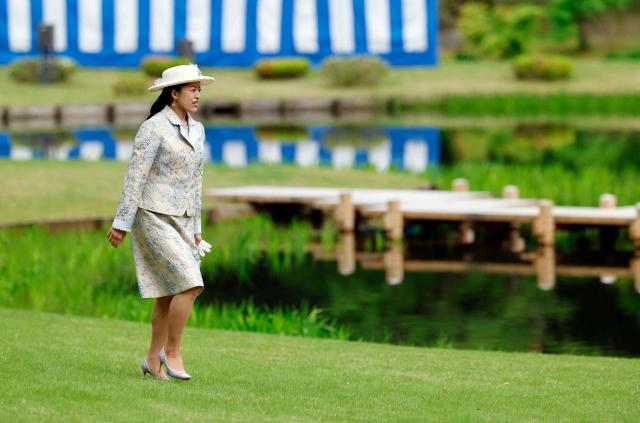 Japan's Princess Tsuguko of Takamado walks on her way to meet guests during the spring imperial garden party at the Akasaka Palace's imperial garden in Tokyo on April 17, 2026. (Photo by Franck ROBICHON / POOL / AFP)